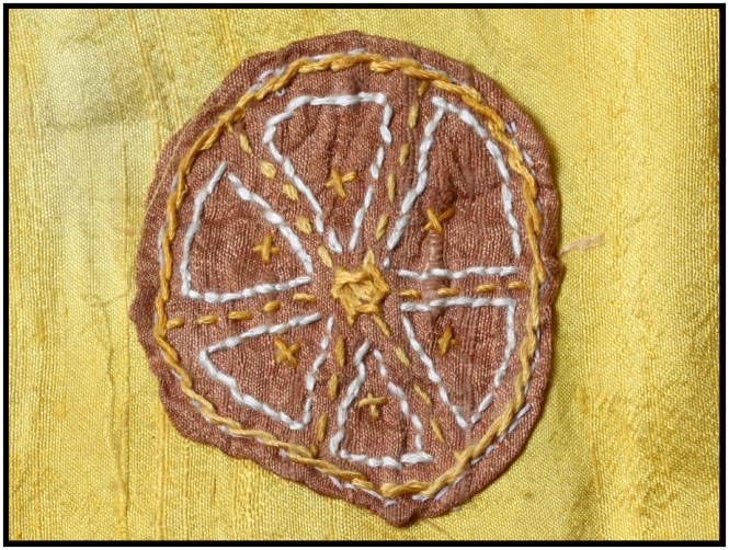 Arbutus dyed silk on marigold dyed silk. Circle is 2.25 inches in diameter.